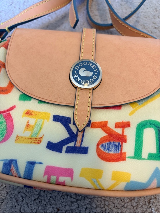 Dooney & Bourke Handbags - Dooney & Bourke Cream Crossbody with Multicolor Logo Print & Tan Trim